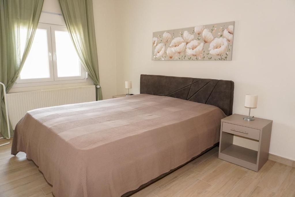 Postel nebo postele na pokoji v ubytování Filios Apartment