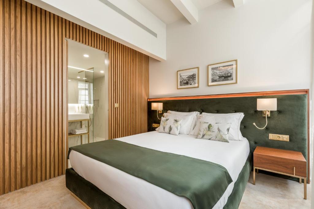 Postel nebo postele na pokoji v ubytování Ribeira Douro Hotel