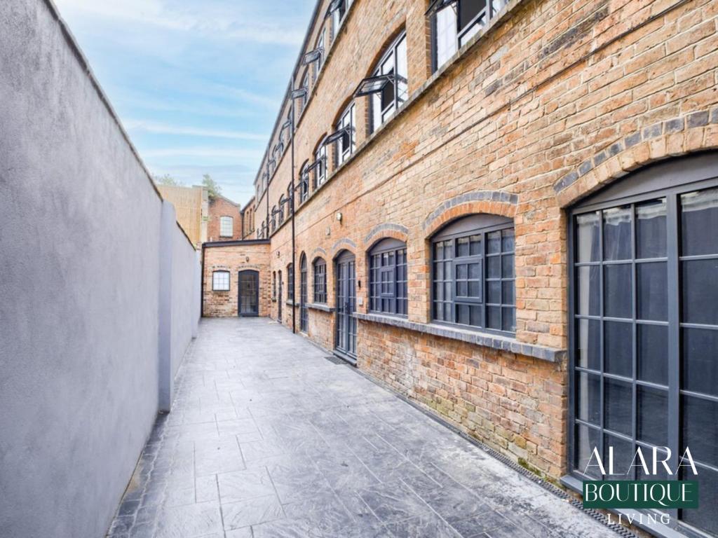 an empty alley in an old brick building at 3 Floor Townhouse Luxury Living Alara Boutique in Birmingham