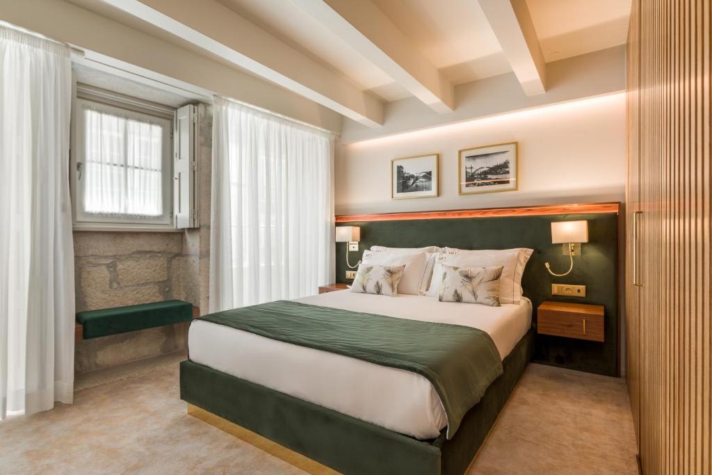 Postel nebo postele na pokoji v ubytování Ribeira Douro Hotel