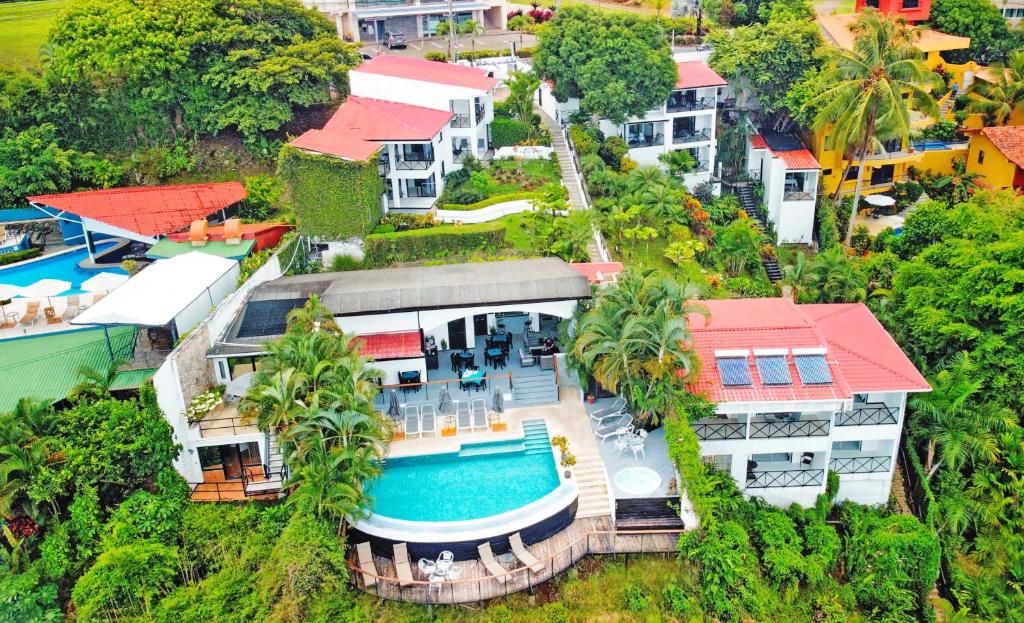 an aerial view of a house with a swimming pool at Villa Roca Boutique Resort & Suites - ADULT ONLY in Manuel Antonio