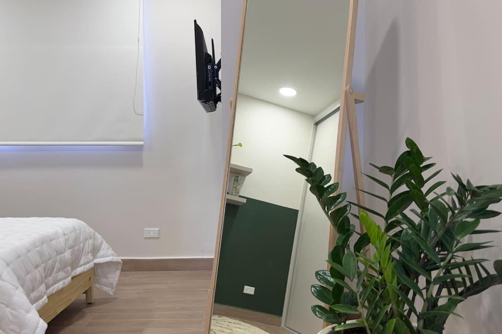 Postel nebo postele na pokoji v ubytování Isthmus Concept Apartment