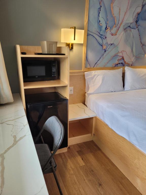 Postel nebo postele na pokoji v ubytování Greenview Inn Riverhead