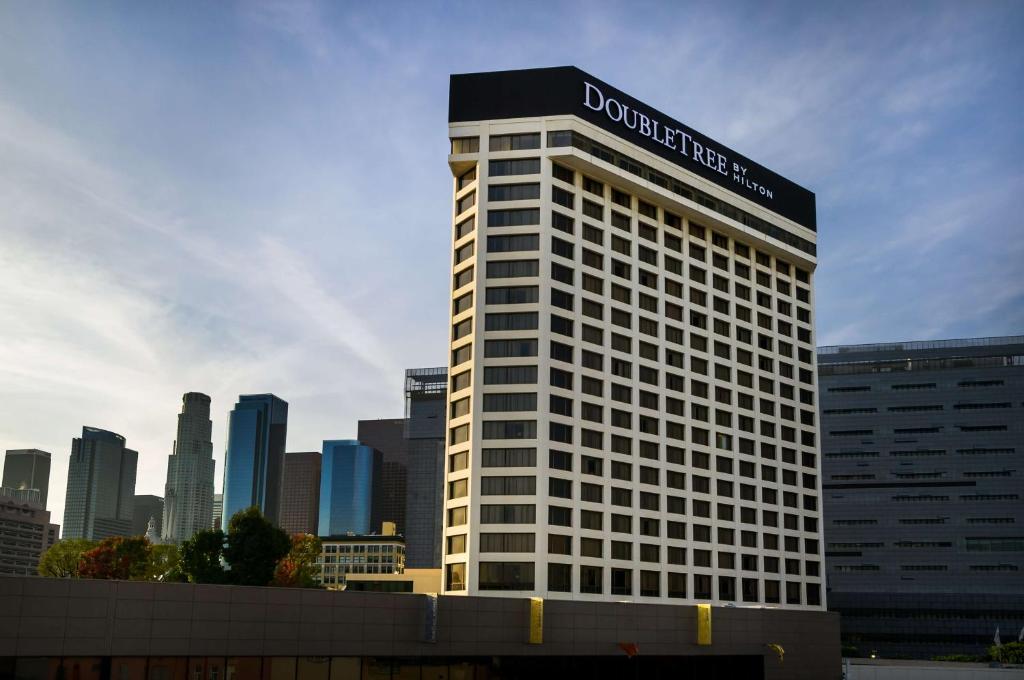 a building with a sign on the top of it at Doubletree by Hilton Los Angeles Downtown in Los Angeles