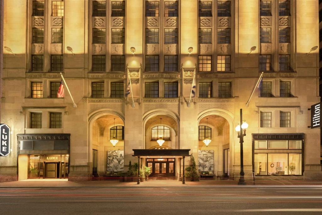 a building on a street in front of a building at Hilton New Orleans / St. Charles Avenue in New Orleans