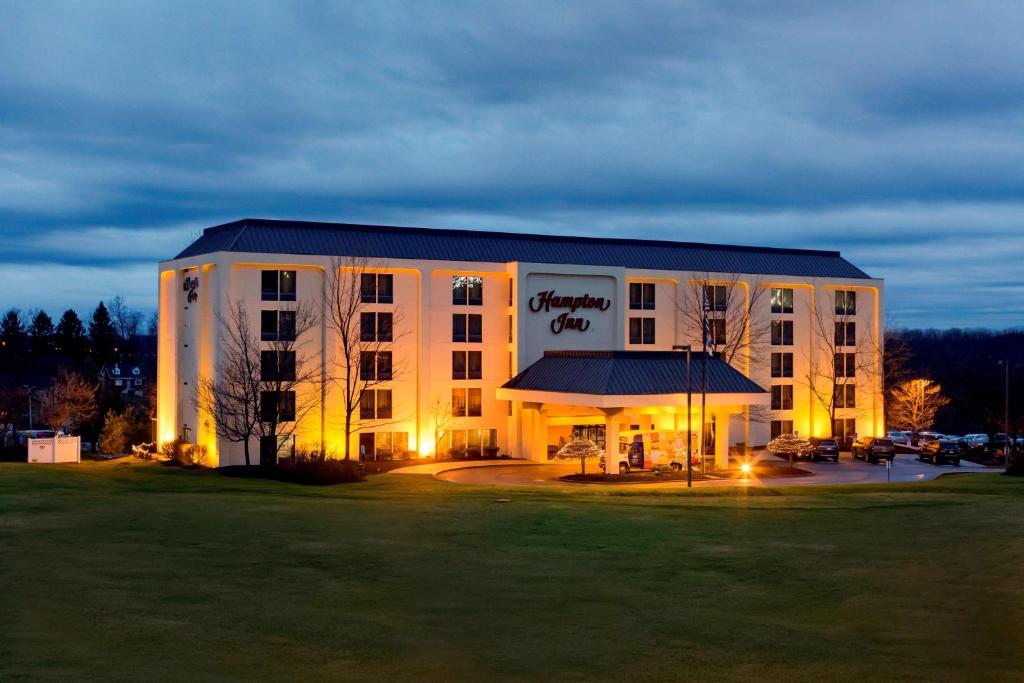 a large building with a sign on the front of it at Hampton Inn Pittsburgh/Airport in Moon Township