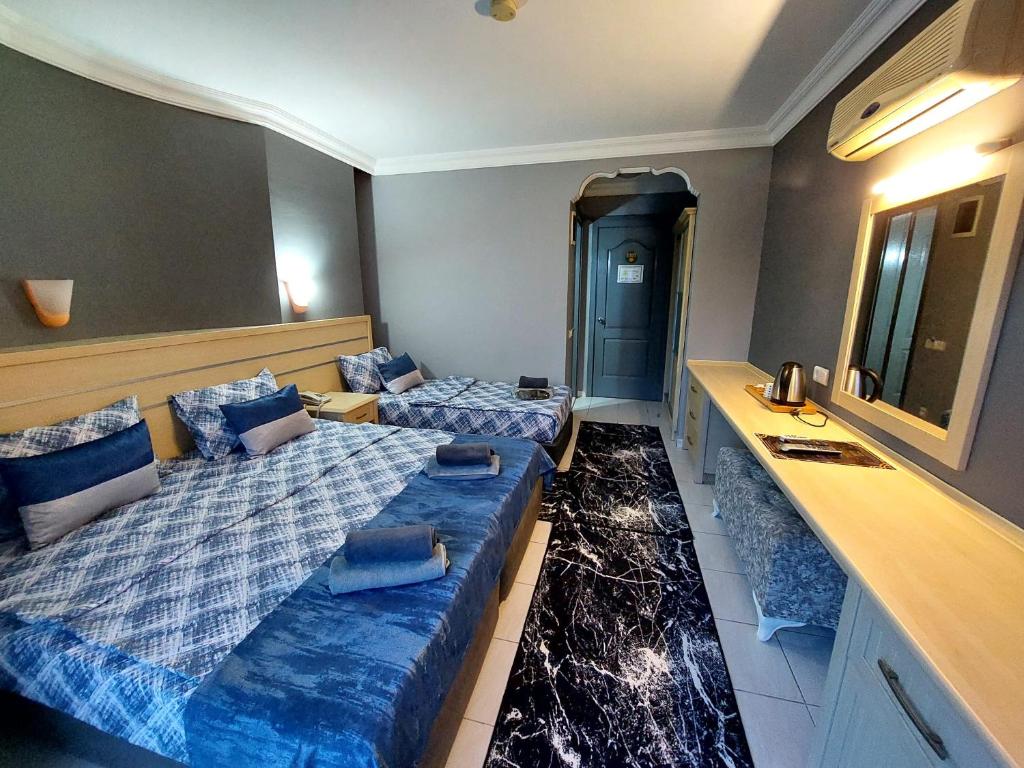 Postel nebo postele na pokoji v ubytování Summer rose hotel
