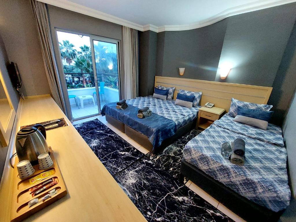 Postel nebo postele na pokoji v ubytování Summer rose hotel