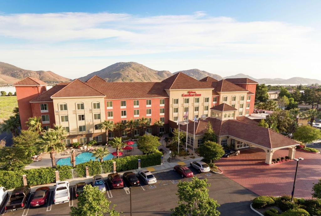 an aerial view of a hotel with a parking lot at Hilton Garden Inn Fontana in Fontana