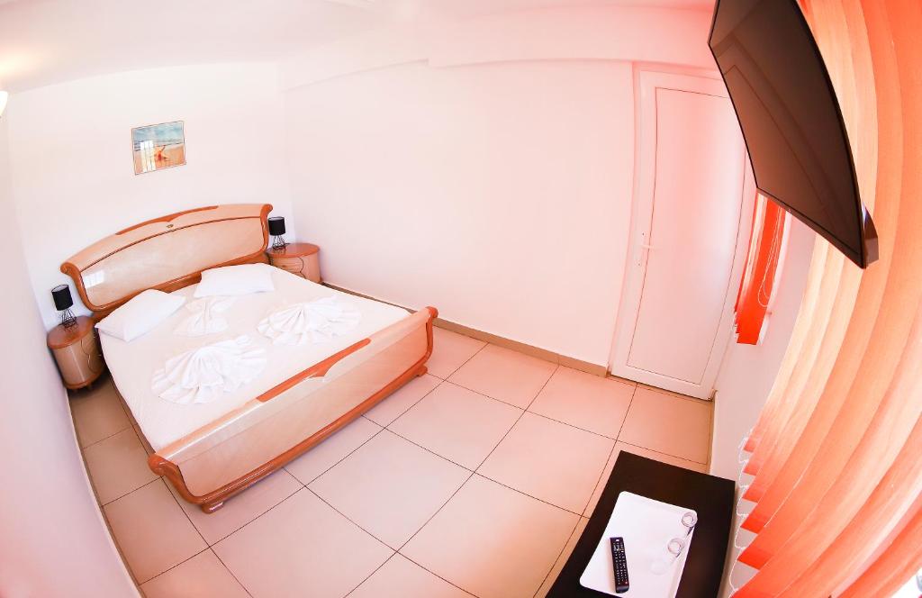 Postel nebo postele na pokoji v ubytování Hotel Proton K3
