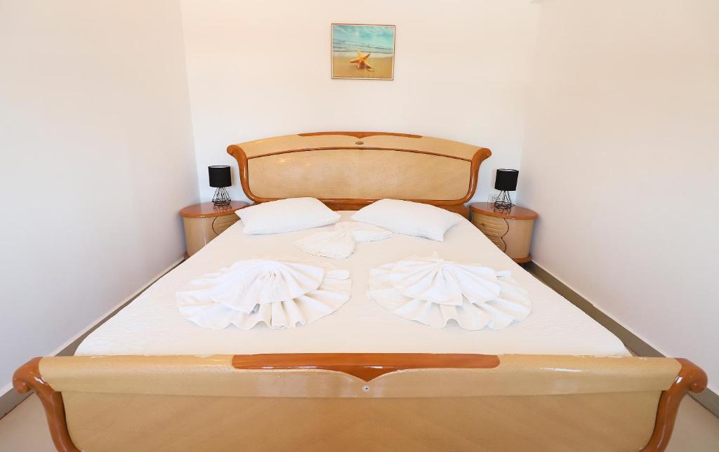 Postel nebo postele na pokoji v ubytování Hotel Proton K3