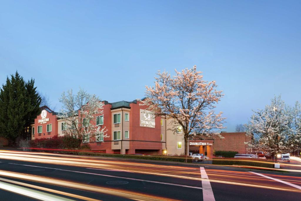 a city street with buildings and streaks of traffic at DoubleTree by Hilton Portland Tigard in Tigard