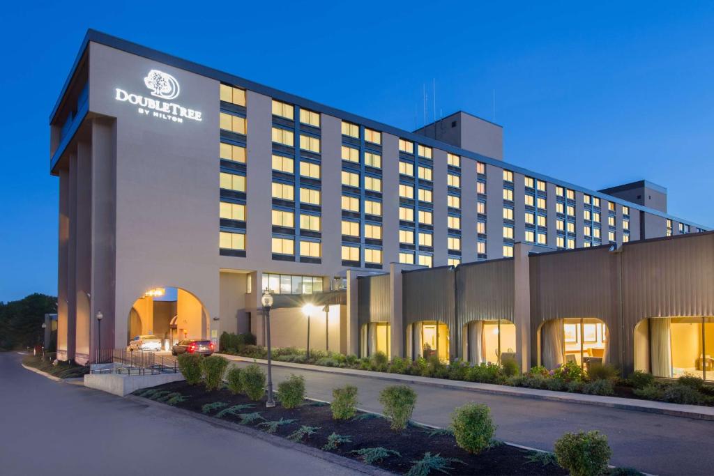 a hotel building with a sign on the front of it at DoubleTree Boston North Shore Danvers in Danvers