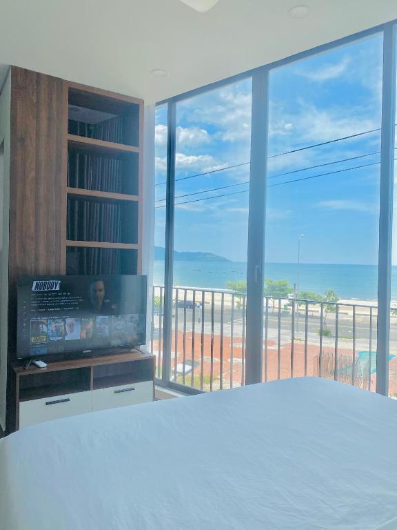 Postel nebo postele na pokoji v ubytování Anstay Beach Da Nang