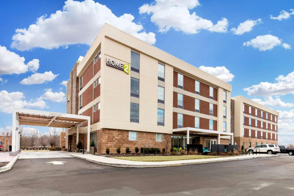 a rendering of a hotel with a building at Home2 Suites By Hilton Olive Branch in Olive Branch
