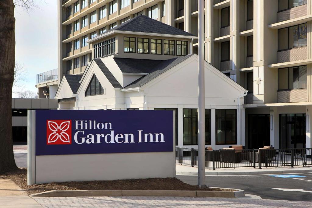 a sign for a garden firm in front of a building at Hilton Garden Inn Reagan National Airport in Arlington