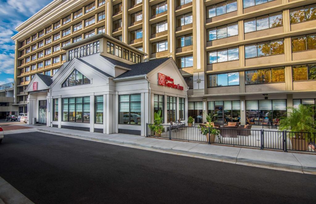 a large building with a store in front of it at Hilton Garden Inn Reagan National Airport in Arlington