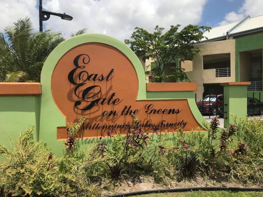 a sign for a cost safe cafe on the streets at Executive Three Bedroom Condo on the Greens in Trincity 