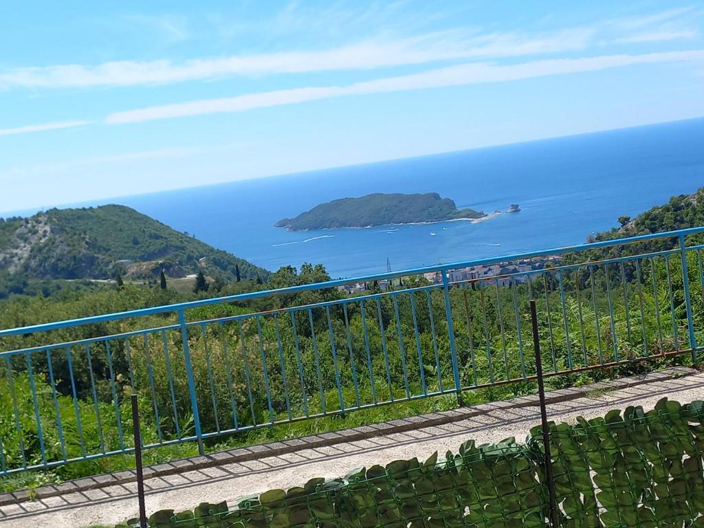 a view of the ocean and an island at Apartmani Vujovic Markovici in Budva