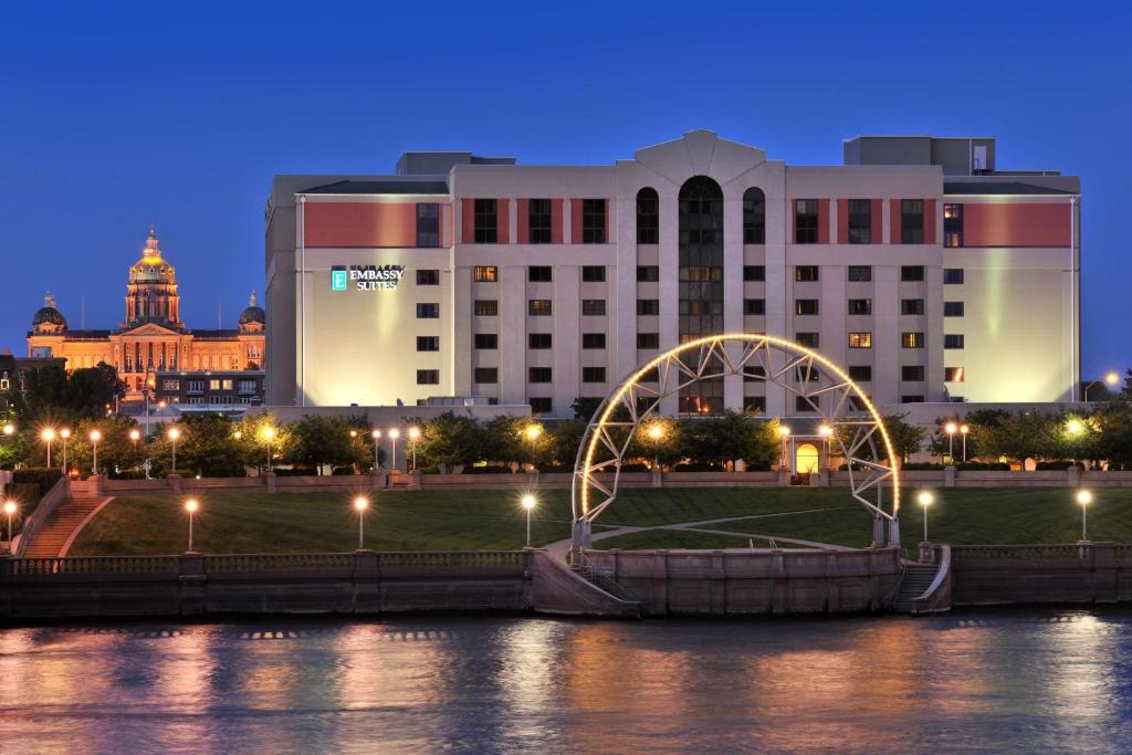 a view of a large building at night at Embassy Suites Des Moines Downtown in Des Moines