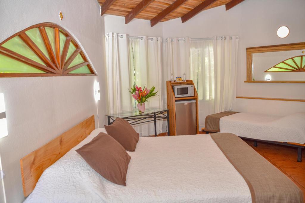 Postel nebo postele na pokoji v ubytování Hotel Luna Llena