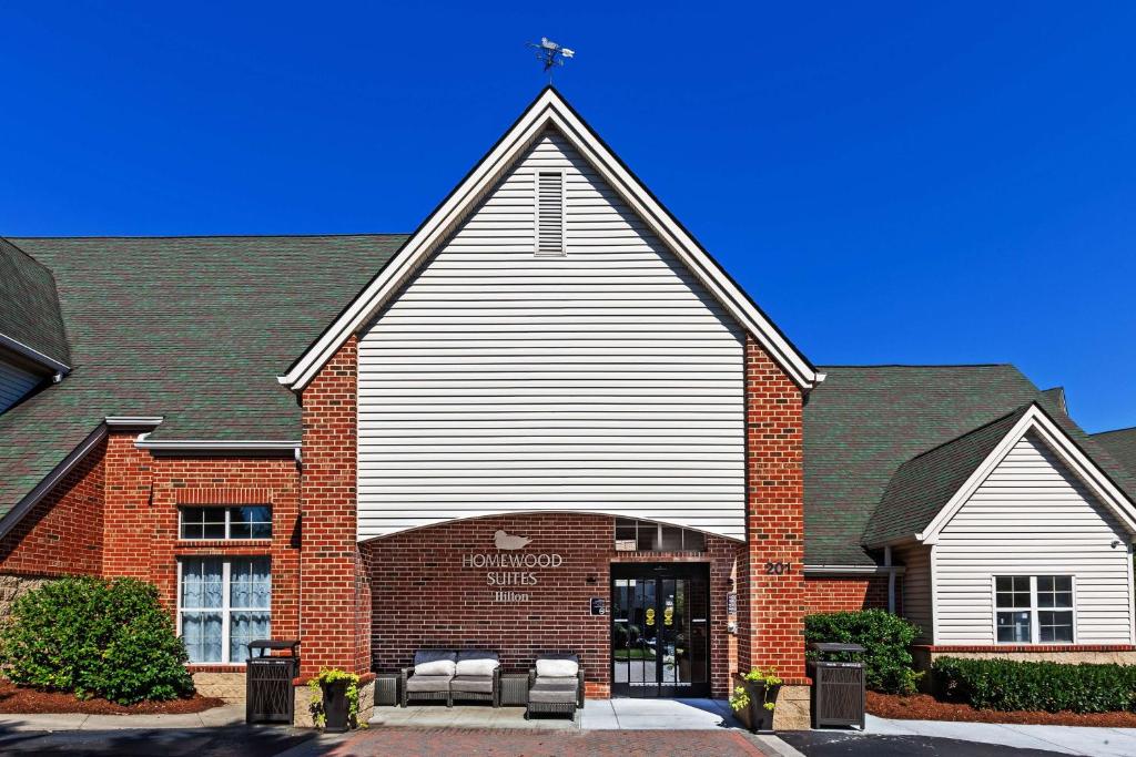 a large church with a cross on top of it at Homewood Suites by Hilton Greensboro in Greensboro