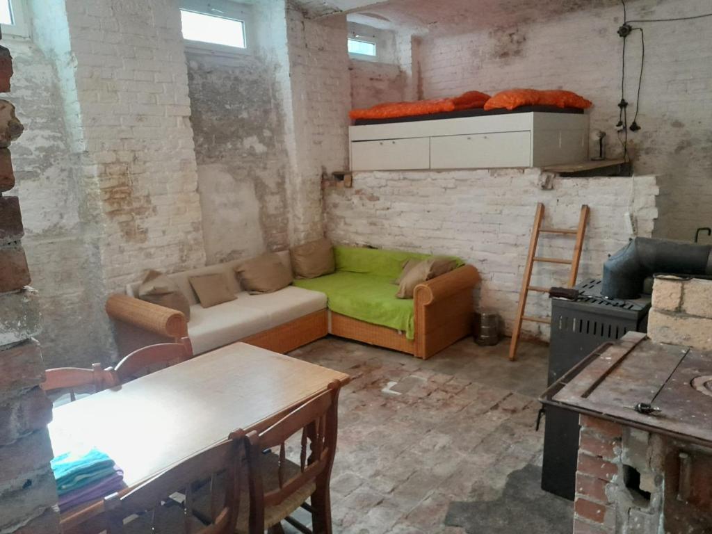 a living room with a couch and a table at Hip center basement studio in Vienna