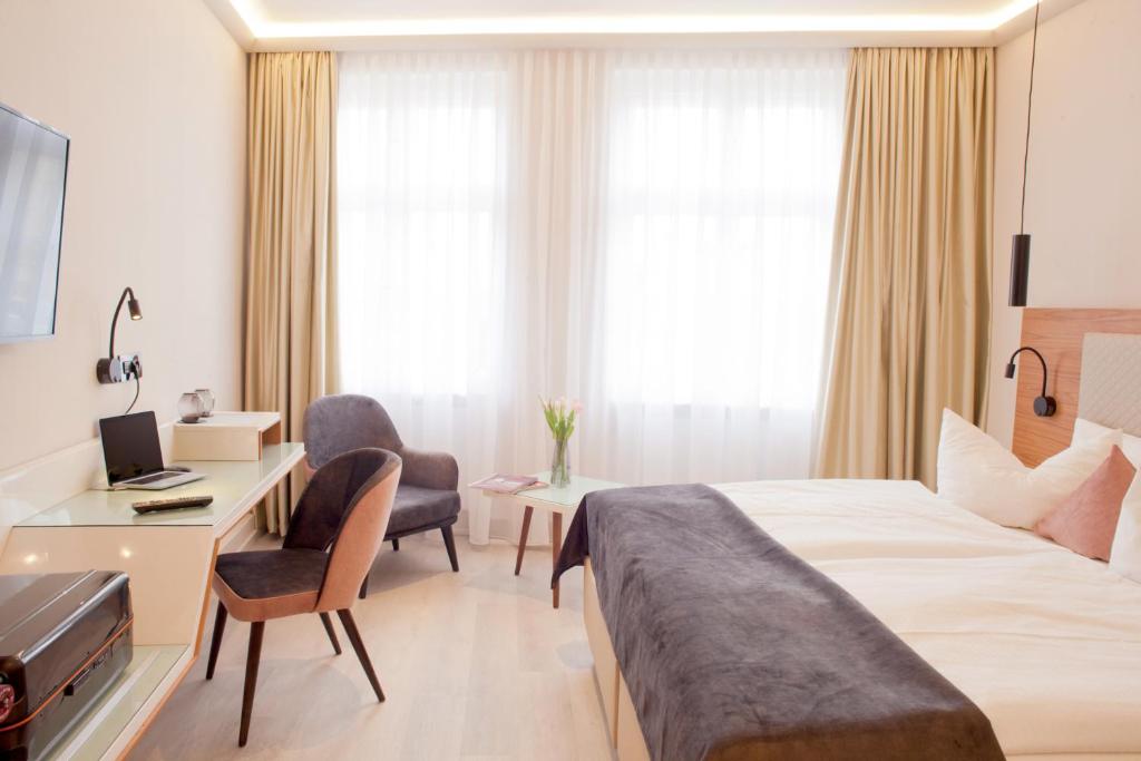 TV a/nebo společenská místnost v ubytování Hotel Schweriner Hof