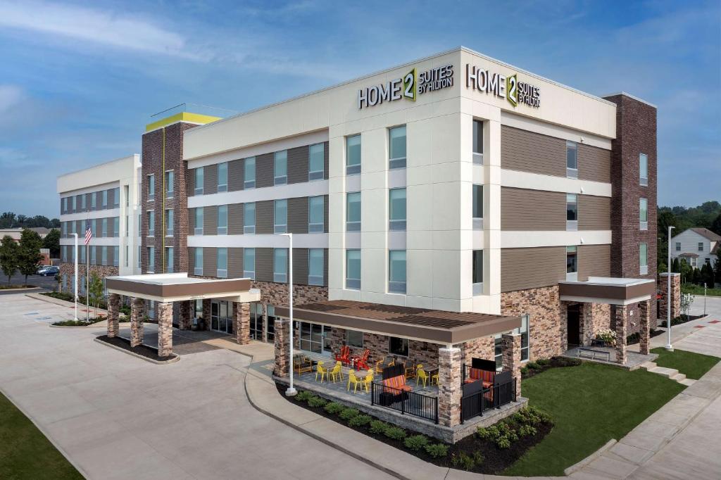 a large building with a store in front of it at Home2 Suites By Hilton Columbus Polaris in Columbus