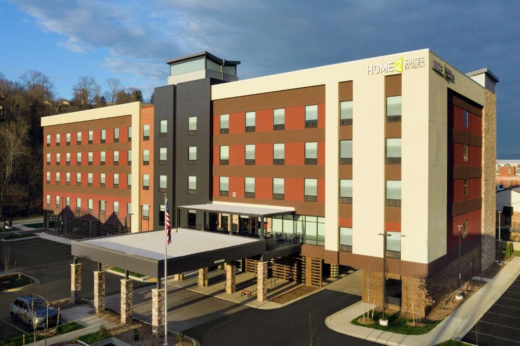 a hospital building with a building with awning in front at Home2 Suites By Hilton Asheville Biltmore Village in Asheville