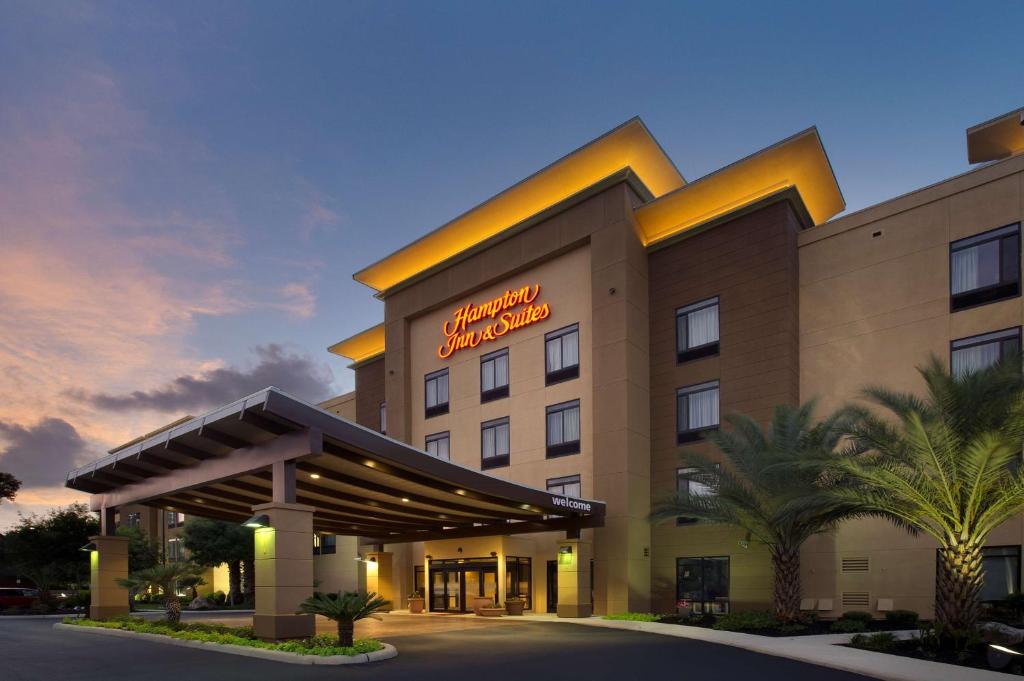 a hotel with a sign on the front of it at Hampton Inn & Suites San Antonio Northwest/Medical Center in San Antonio