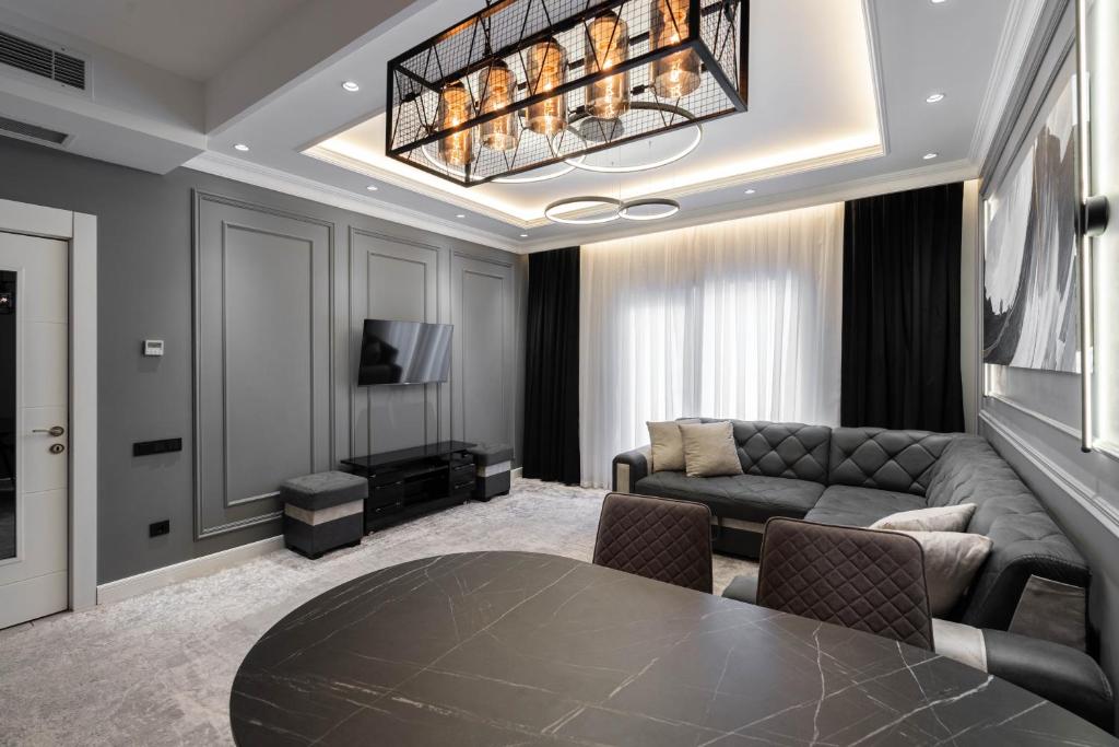 a living room with a couch and a table at Istanbul Apartment 01 in Tashkent