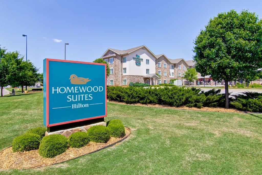 a sign in a yard in front of a house at Homewood Suites by Hilton Oklahoma City-West in Oklahoma City