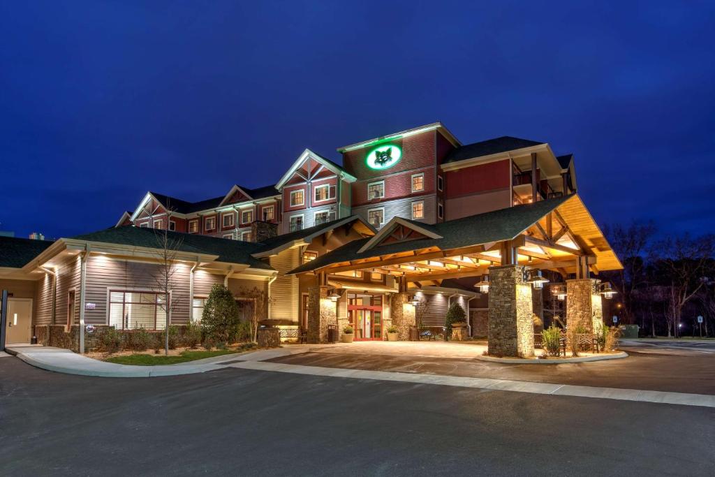 a rendering of a hotel at night at Black Fox Lodge Pigeon Forge, Tapestry Collection by Hilton in Pigeon Forge