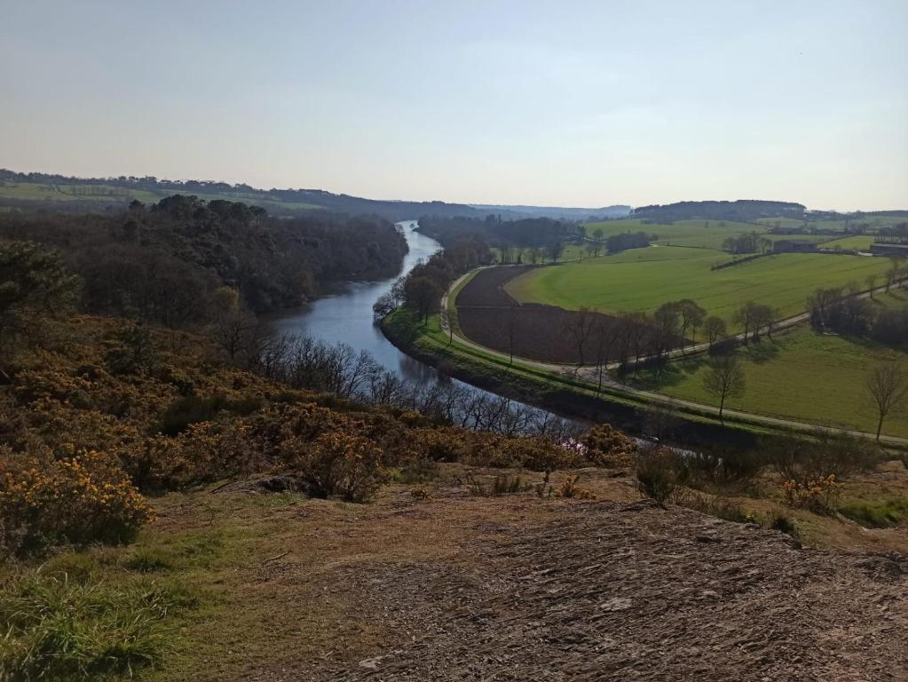 a view of a river from a hill at Appartement tout confort in Guipry-Messac