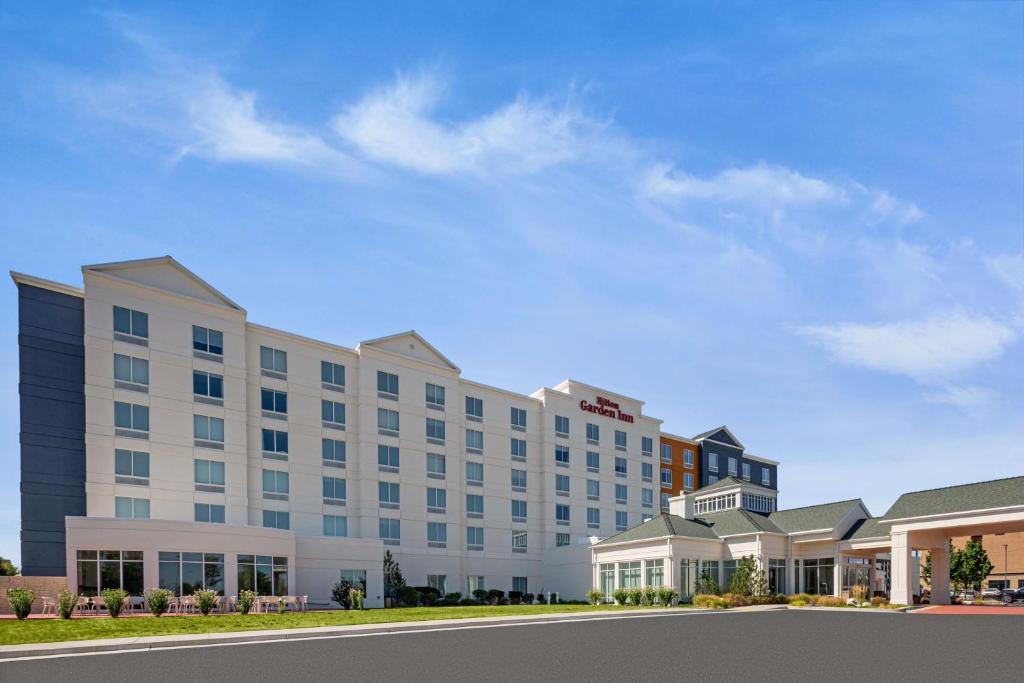 a rendering of a hotel with a row of buildings at Hilton Garden Inn - Salt Lake City Airport in Salt Lake City