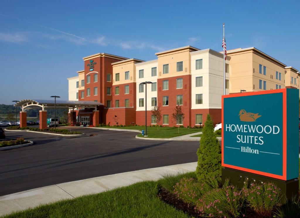 a sign in front of a building with a townhood suites at Homewood Suites by Hilton Pittsburgh Airport/Robinson Mall Area in Moon Township