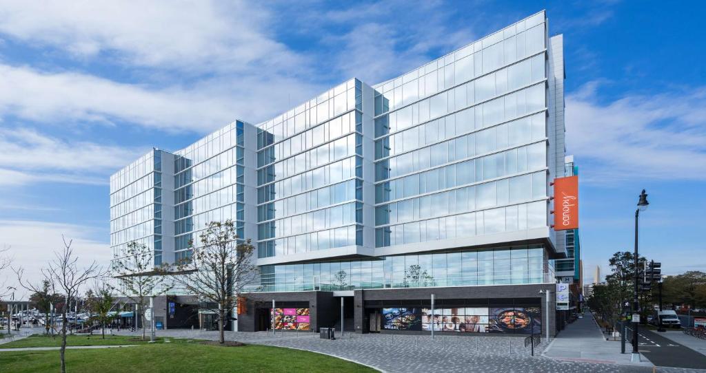 a large building with two tall glass buildings at Canopy By Hilton Washington DC The Wharf in Washington