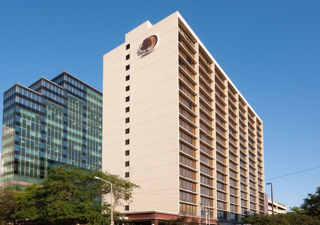 a tall white building with a clock on it at DoubleTree by Hilton Hotel Cleveland Downtown - Lakeside in Cleveland