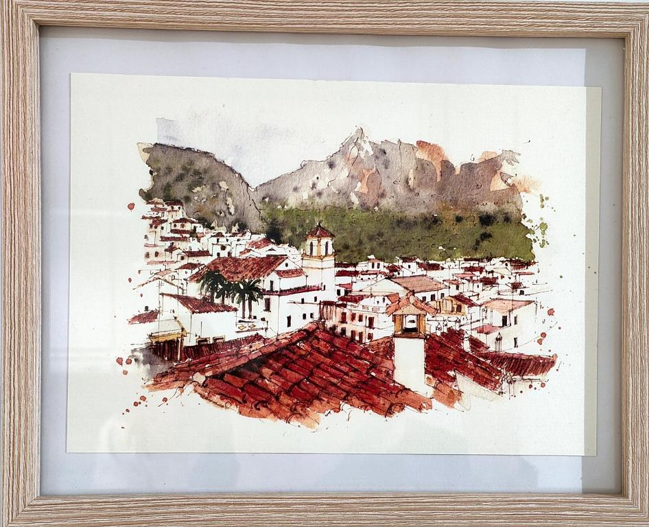 une peinture d'un village dans les montagnes dans l'établissement La Damajuana, Casa Rural, à Montejaque