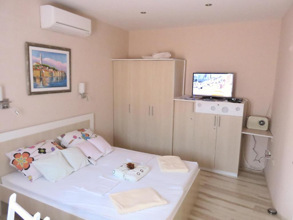 Postel nebo postele na pokoji v ubytování Apartments Cico