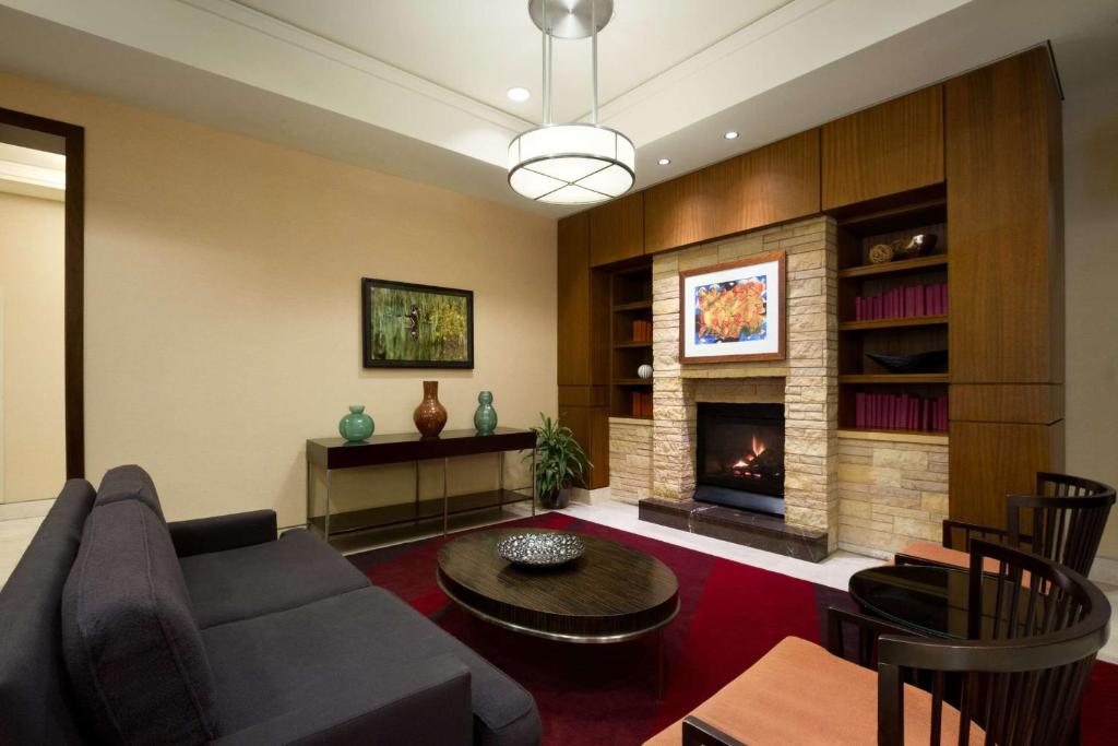 a living room with a couch and a fireplace at Homewood Suites by Hilton Baltimore in Baltimore
