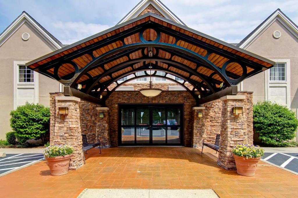 a large entrance to a home with a brick and stone building at Homewood Suites by Hilton Stratford in Stratford