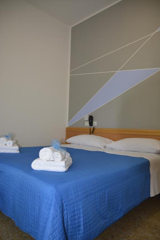 Postel nebo postele na pokoji v ubytování Martina's Hotel