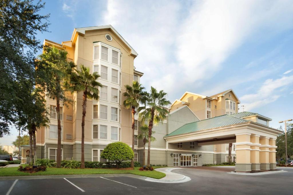 a rendering of a hotel with a parking lot at Homewood Suites by Hilton Orlando-Intl Drive/Convention Ctr in Orlando