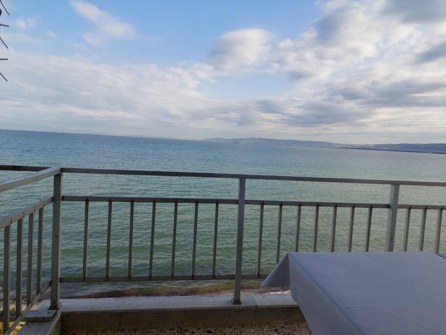 a view of the ocean from a balcony at Endless Blue, In the wave in Perea