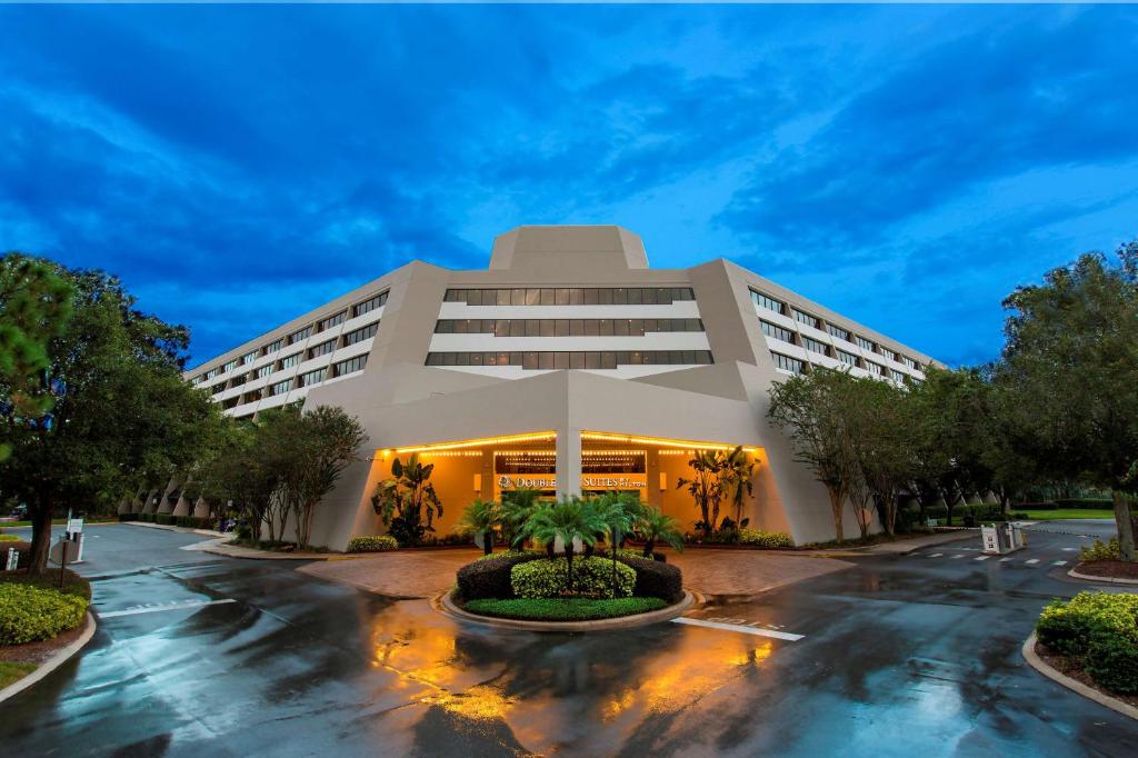 a rendering of a hotel building at night at DoubleTree Suites by Hilton Orlando at Disney Springs in Orlando