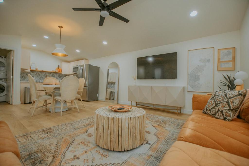 a living room with a couch and a table at East Downtown Desert Chic Casita-Hot Tub-Pet Friendly-No Pet Fees! in Albuquerque