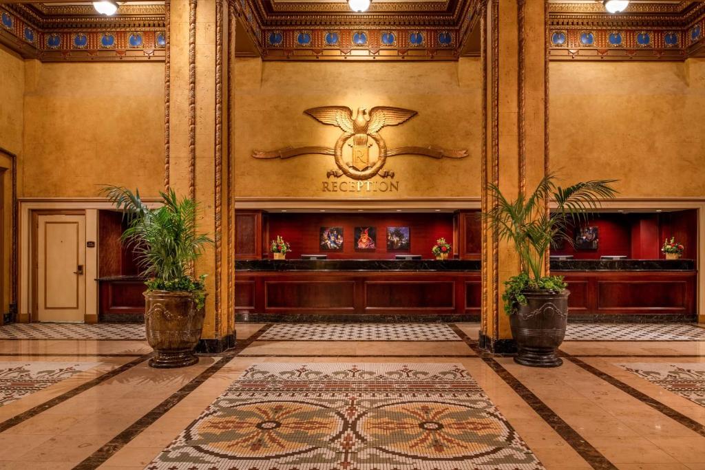 a lobby of a building with a rug on the floor at The Roosevelt Hotel New Orleans - Waldorf Astoria Hotels & Resorts in New Orleans