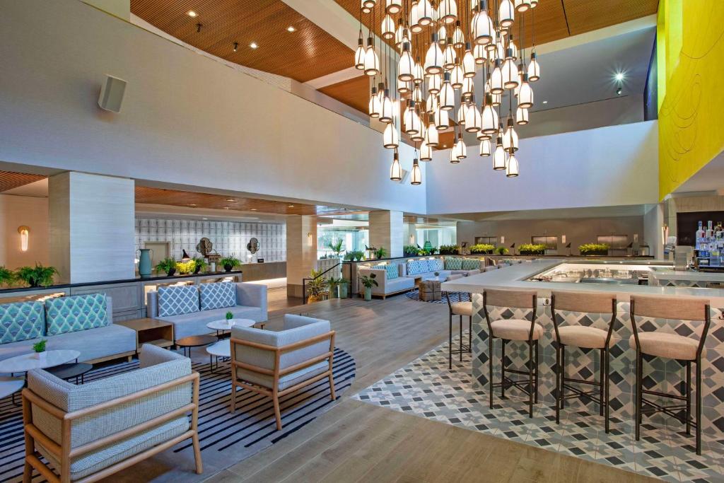 a lobby of a hotel with a chandelier at Hilton San Jose in San Jose